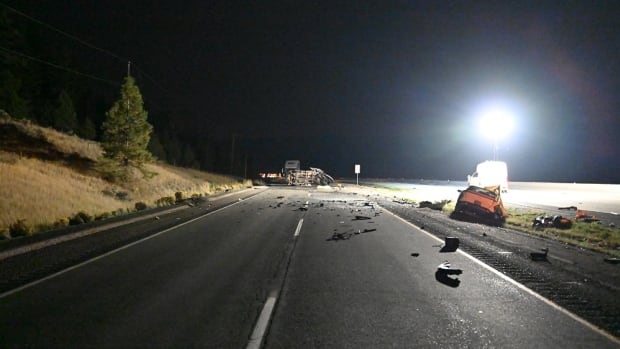 The remnants of a bad car crash in the nighttime
