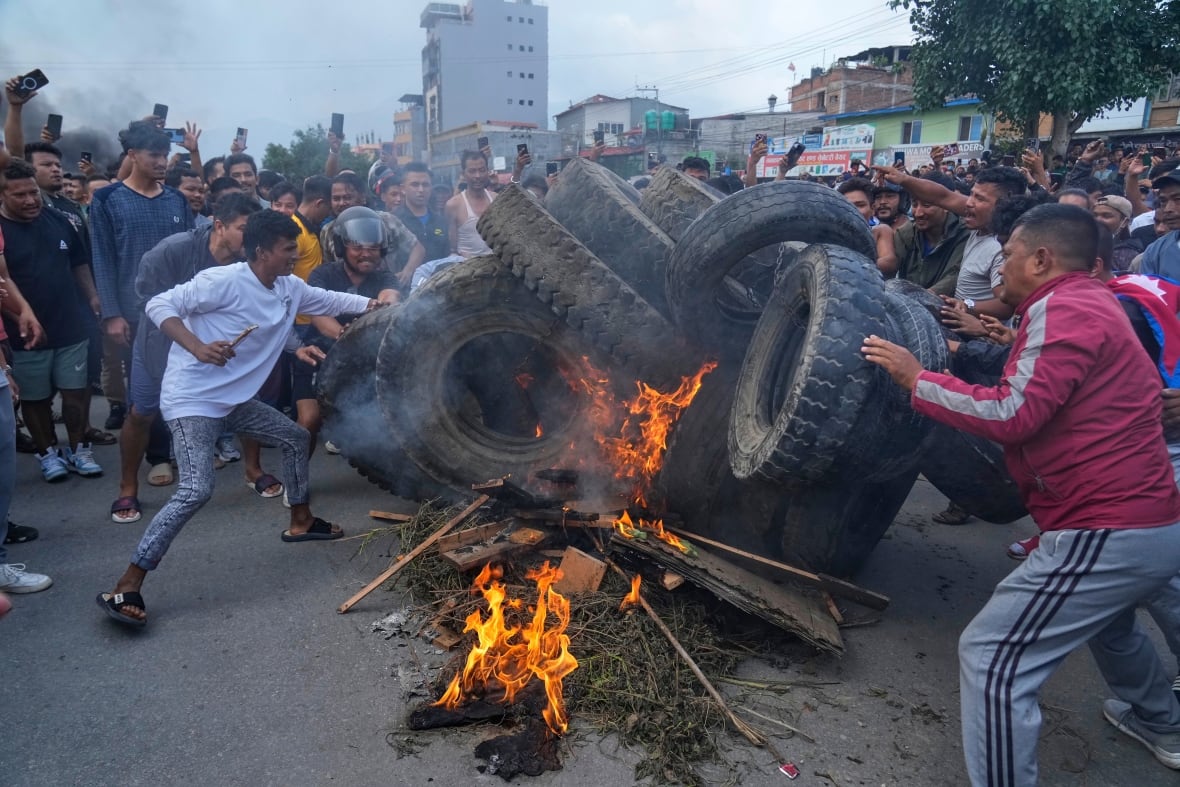 Protesters burned tires on Nepal roads.