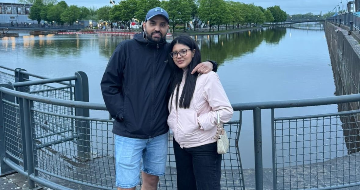 A man and a woman posing for a photo