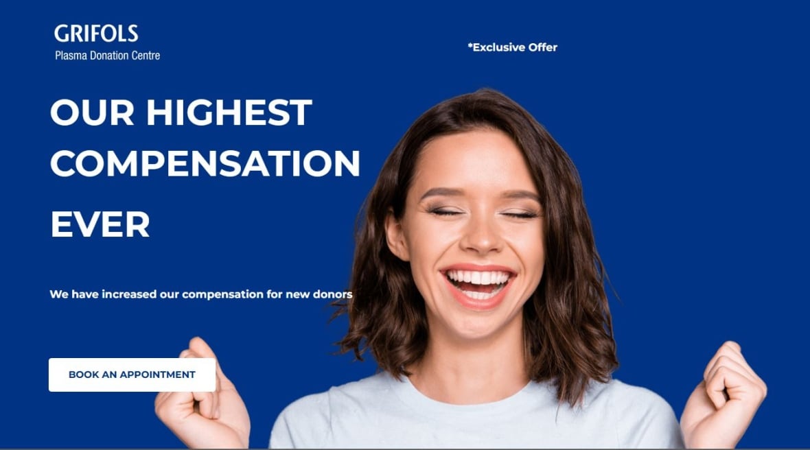 An advertisement on blue background with a a smiling woman beside text that says "GRIFOLS Plasma Donation Centre *Exclusive Offer OUR HIGHEST COMPENSATION EVER We have increased our compensation for new donors BOOK AN APPOINTMENT."