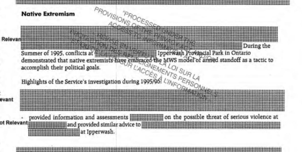A picture of piece of paper with redactions throughout.