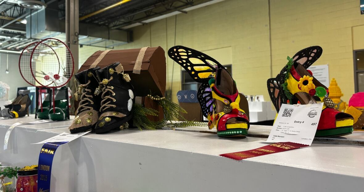 Three pairs of high heels. One with badminton nets and birdies on top, another inside a treasure chest, another with butterfly wings. 