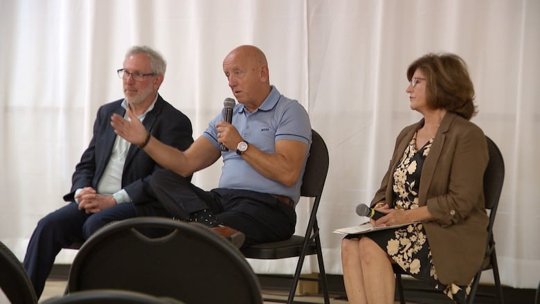 A group of people sitting in chairs