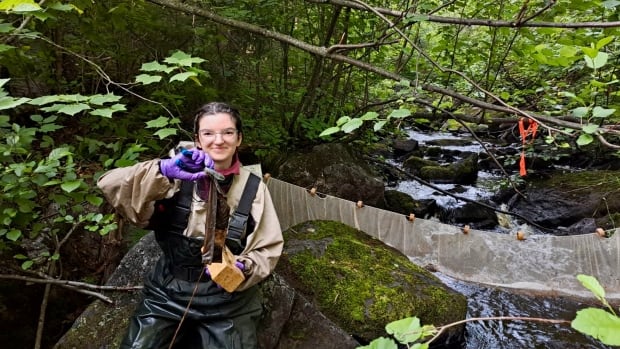 A girl holds a biofilm sample