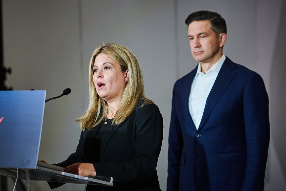 Conservative MP Michelle Rempel Garner, left, speaks as Conservative Leader Pierre Poilievre stands by at a press conference in Mississauga, Ont., on Wednesday, Sept. 3, 2025.