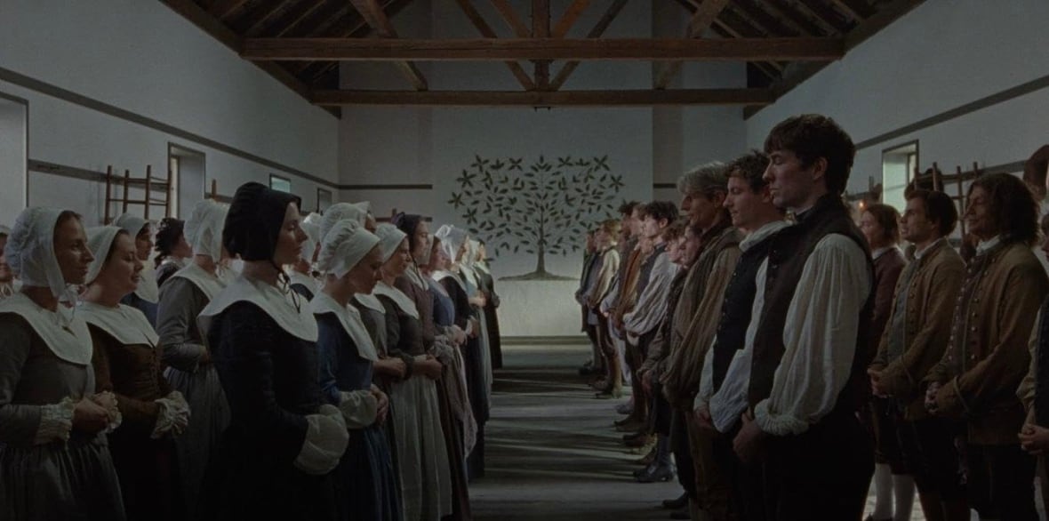 Two groups of people in period costume stand facing one another.