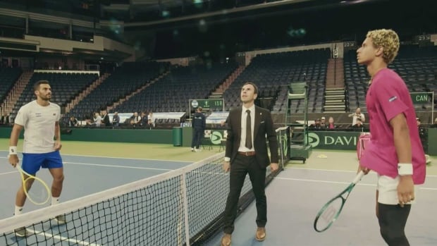 Two male tennis players. 