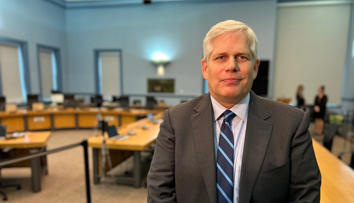 A man standing in a conference room