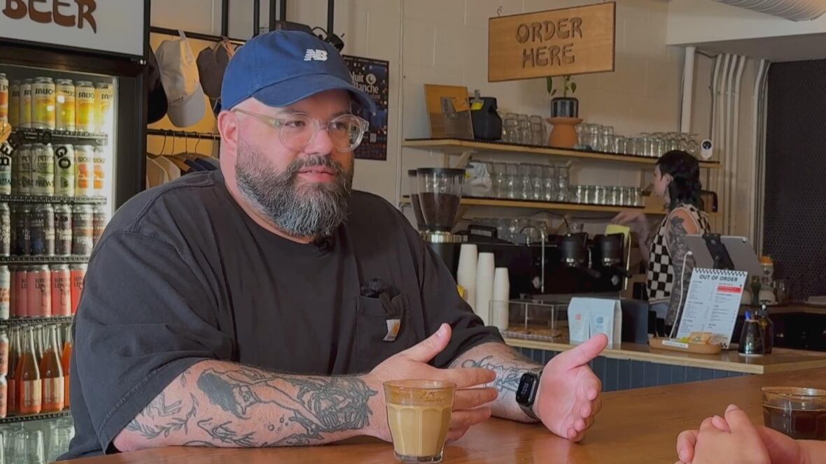 close up of man in cafe with coffee