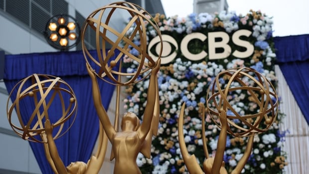 Statuettes before a CBS logo are shown.