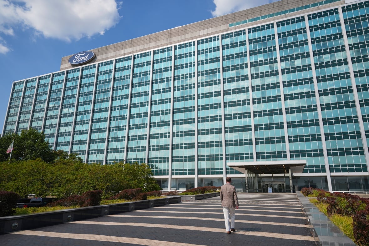 A large rectangular building with the Ford logo along one corner of the ceiling