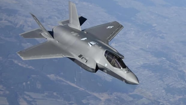 A military jet is seen in the air