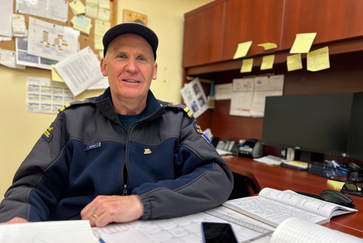 A man sitting at a desk.
