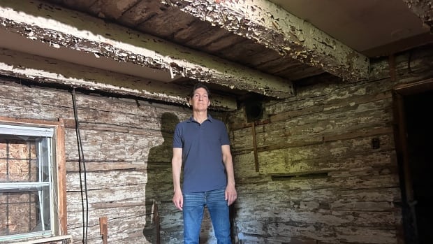 Andrew Lenkov, who moved into a home beside the Sand Road lot about two years ago, first heard about the old cabin from local seniors. He has led the drive to have the site protected from development.