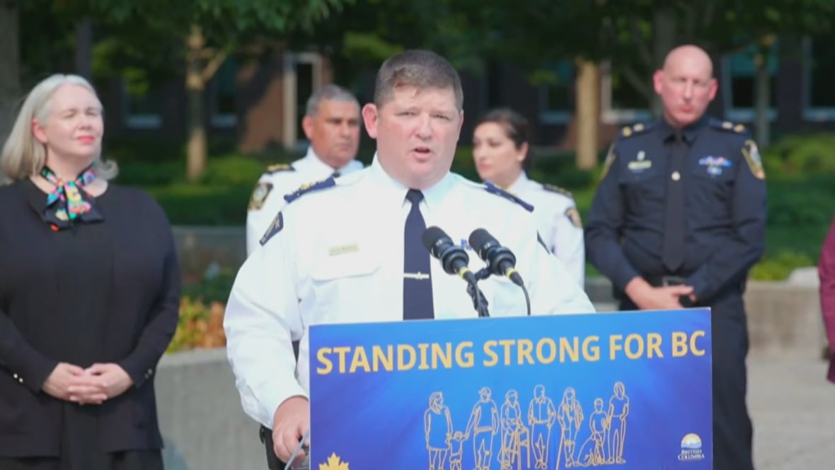 man, white, speaks at podium