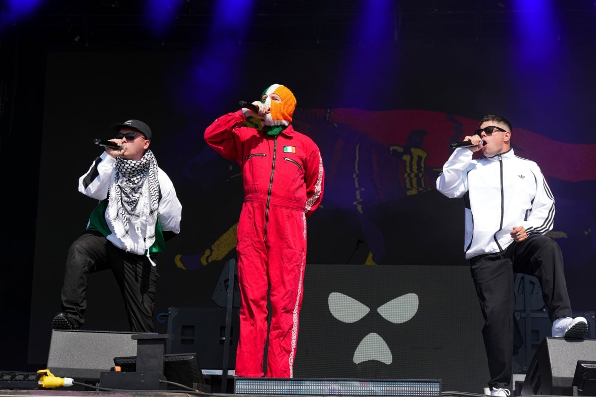 Kneecap performs on stage.