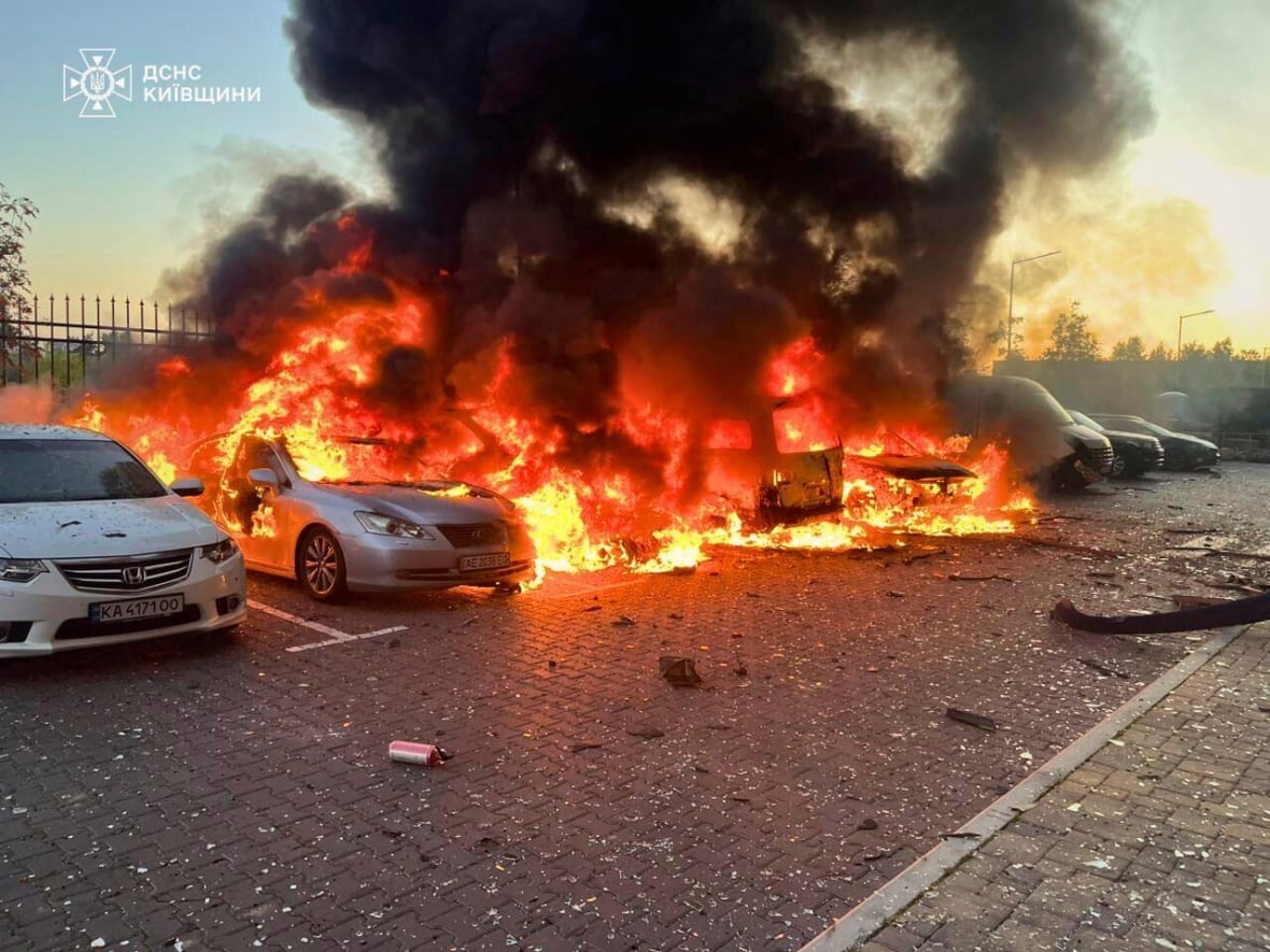 Cars are seen on fire.