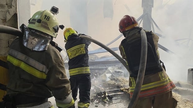 Rescue workers put out a fire of a residential house.