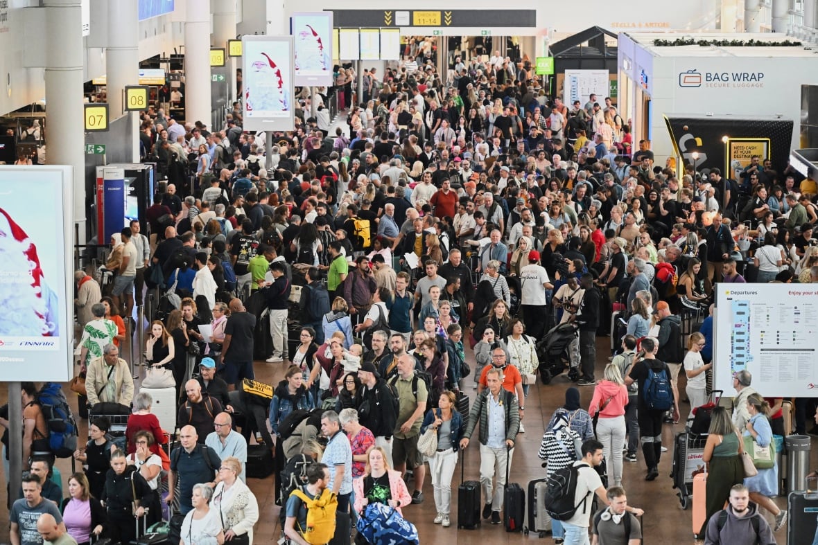 People walk next to the departure council.