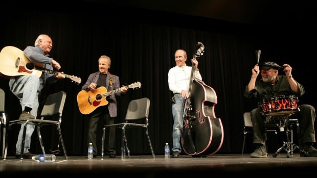 FILE - From left, Sonny Curtis, Bobby Vee, Joe B. Maudlin and Jerry J.I. Allison perform at the Stillman auditorium in Clear Lake, Iowa on Friday Jan. 30, 2009. (AP Photo/The Globe-Gazette, Teresa Prince, File) Musicians on stage