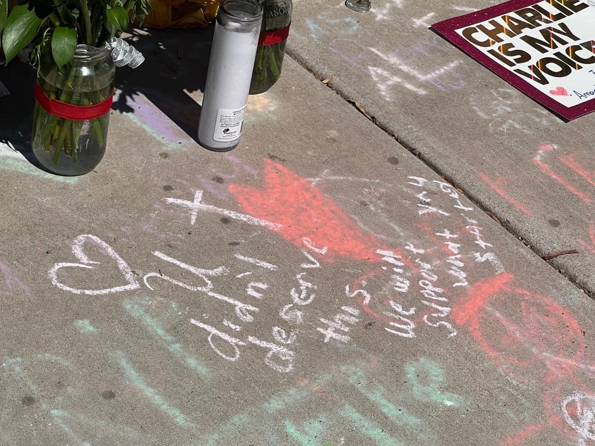 A message in the chalk on the sidewalk of the temporary memorial in front of the headquarters of Turning Point Usa. Read: "You do not deserve this. We will support what you started."