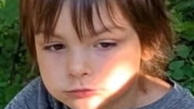 a close up shot of a young boy 