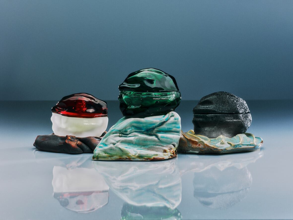The photo shows three sculptural vessels made in translucent materials.