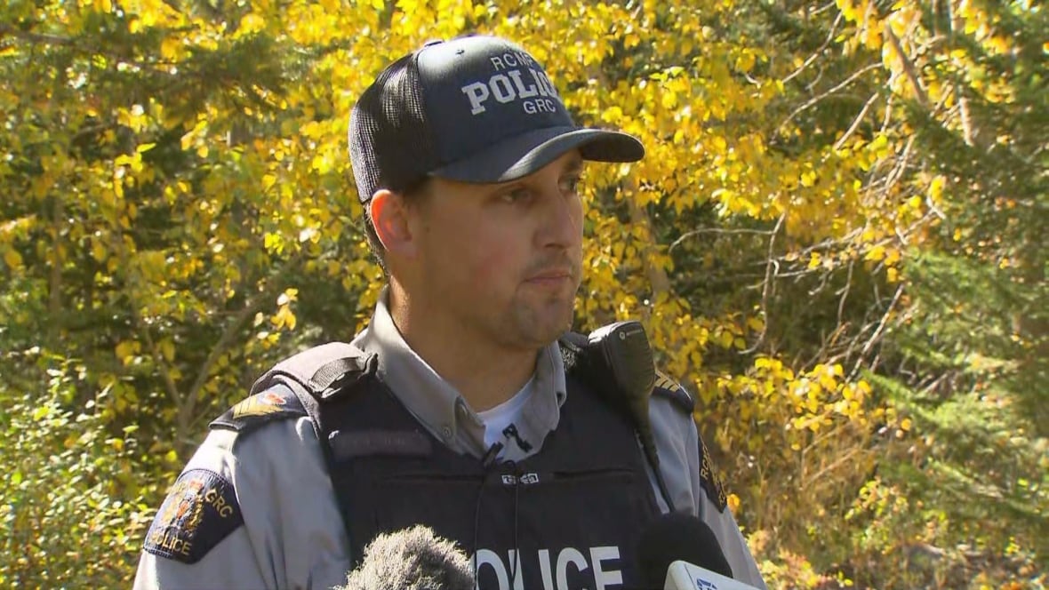 A man wearing a police uniform is pictured.