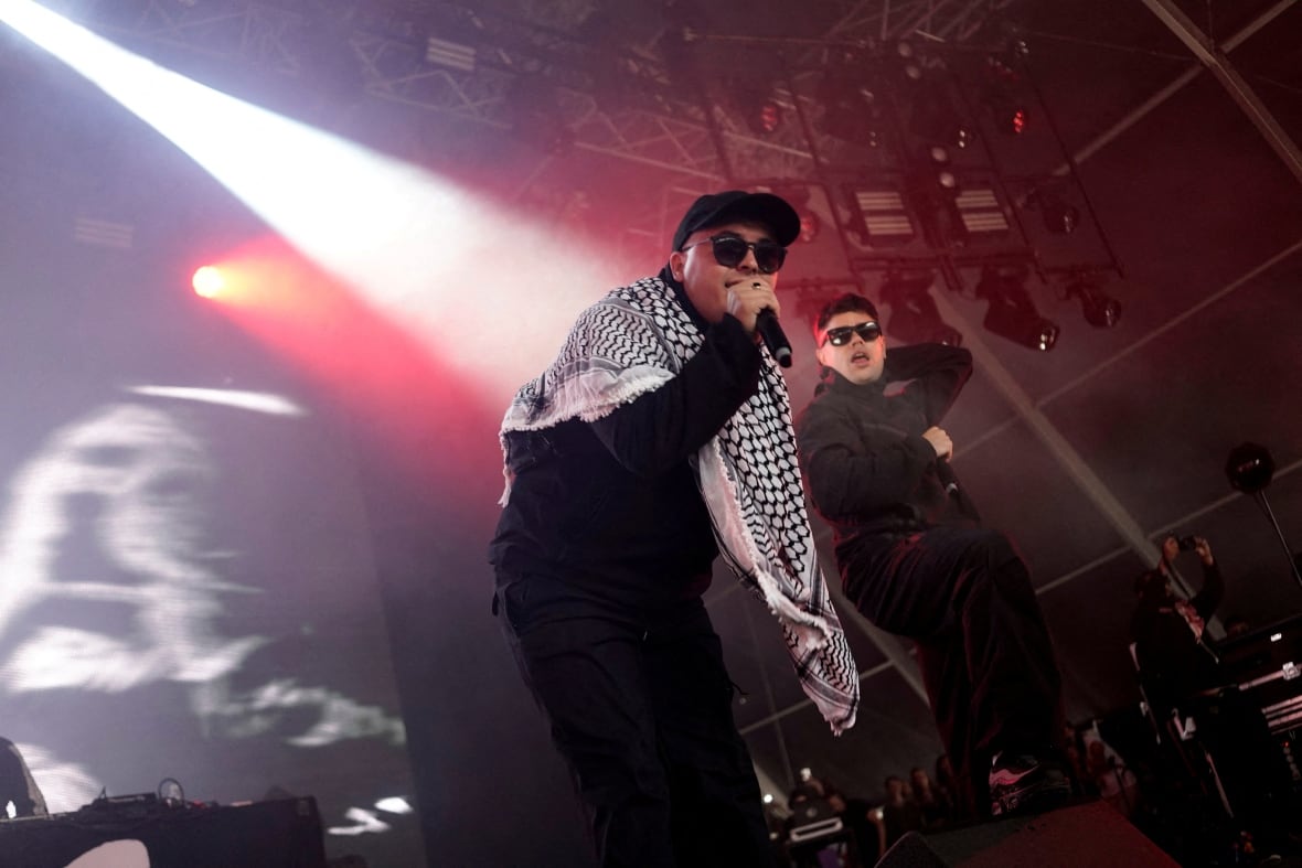 Men on stage scream in the microphones.