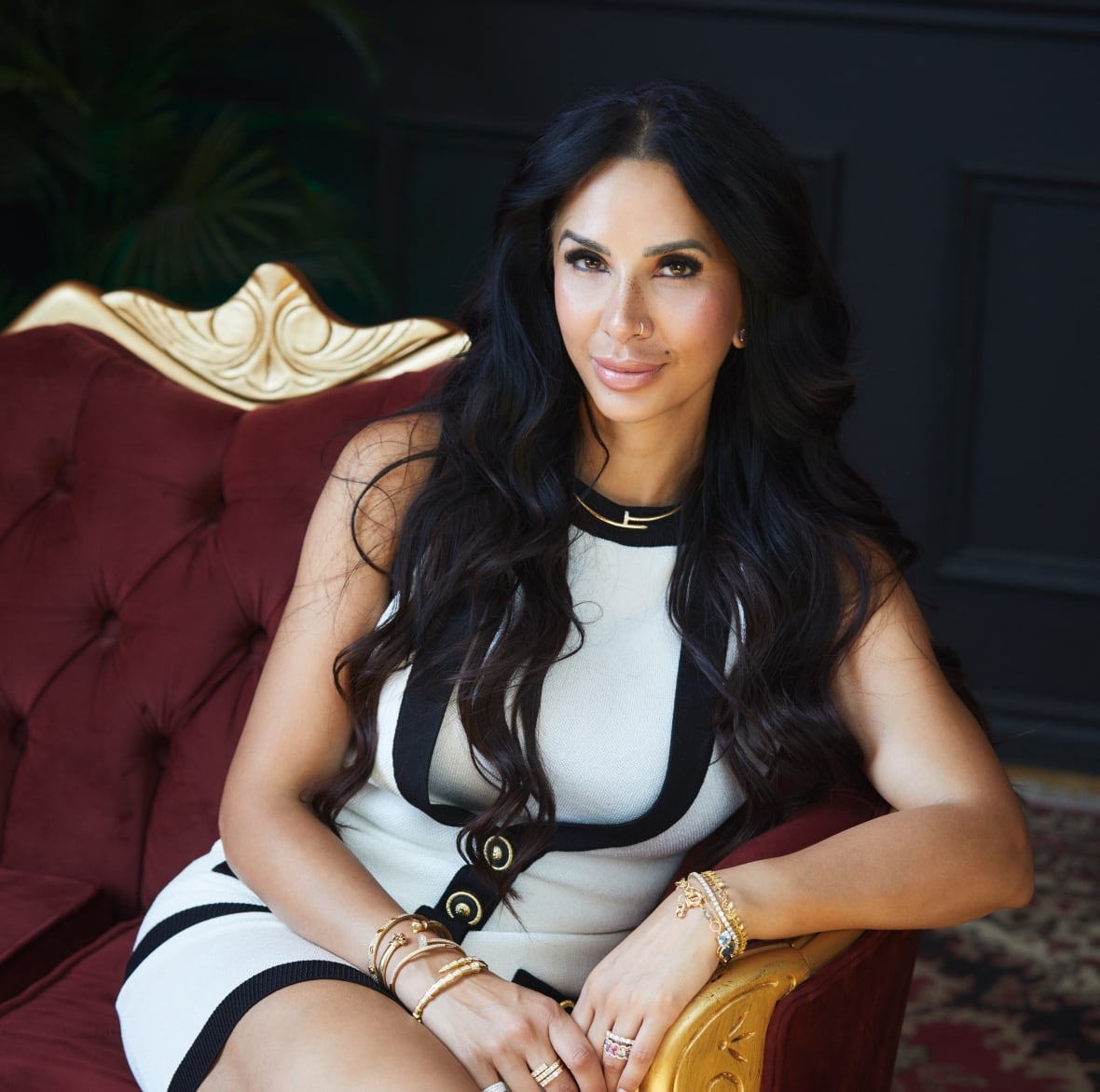 A woman sits on a chair 