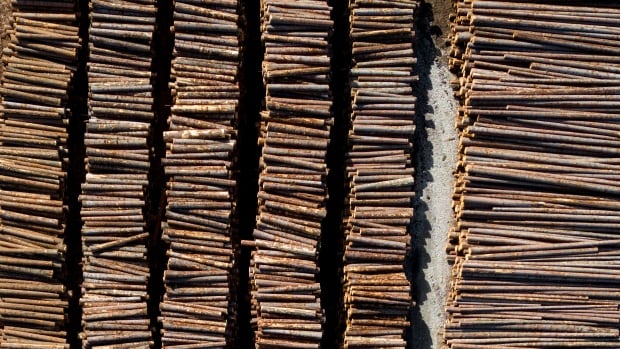 Logs are seen stacked at Gorman Brothers Lumber sawmill, in West Kelowna, B.C.