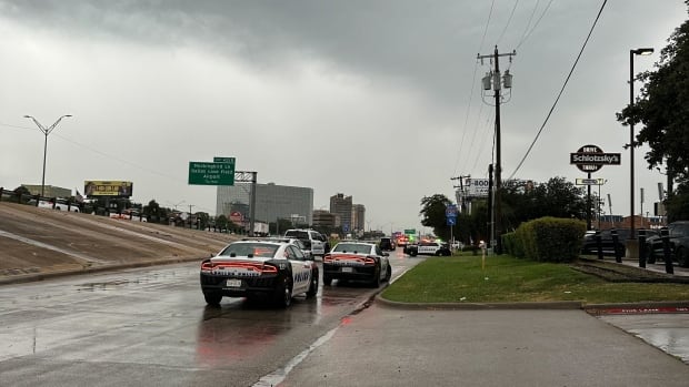 Police cars seen blocking off a freeway.