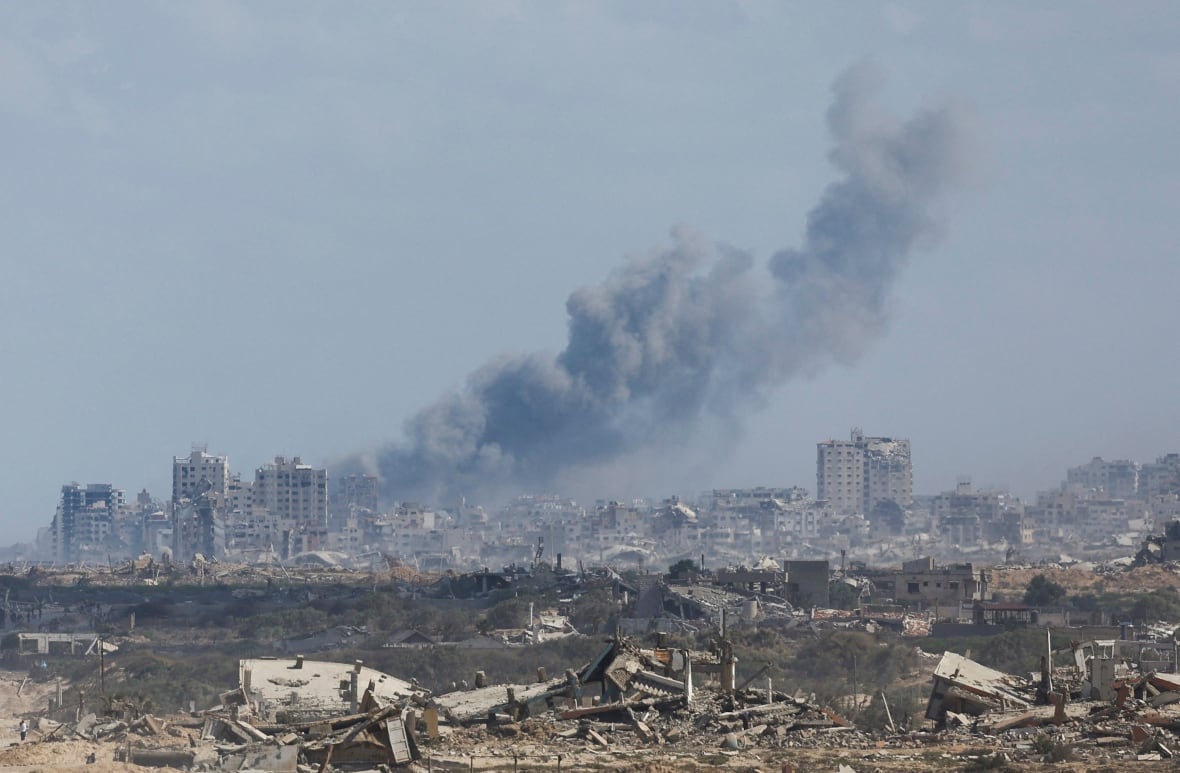Smoke rises from afar.