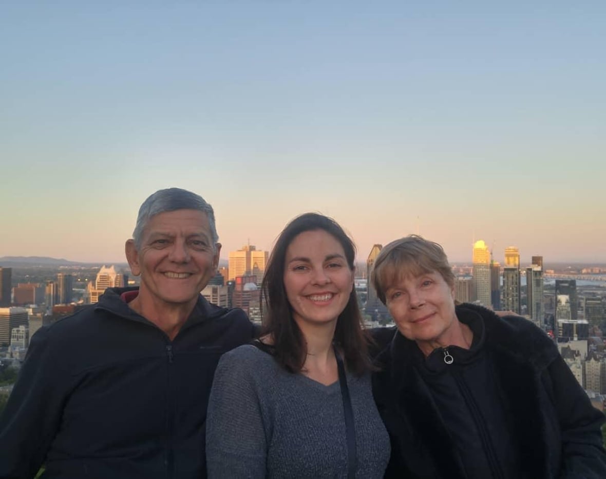 A woman with her parents at the Montreal lookout. 