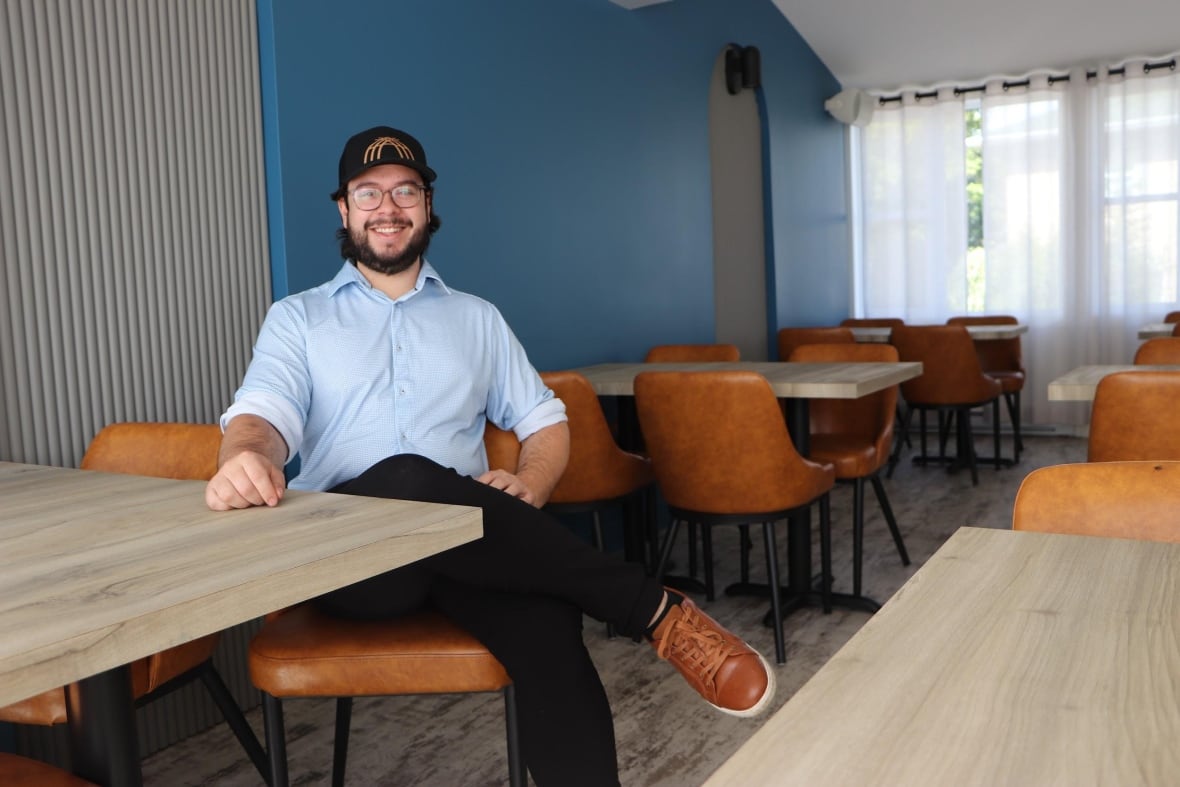 A man sitting in a restaurant. 