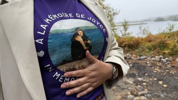 A person wearing a purple shirt. 