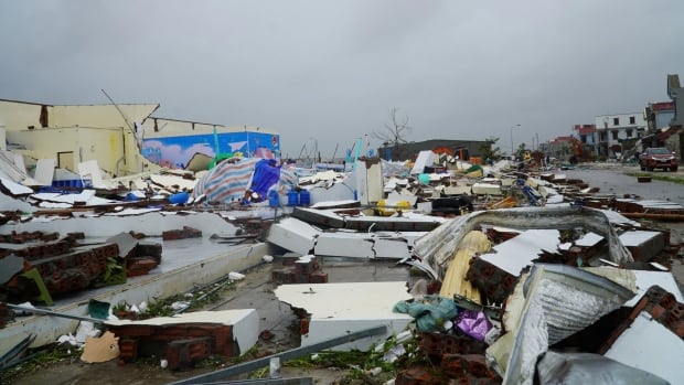 Wood and other debris from buildings is shown on the ground after a storm.