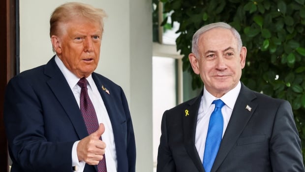 U.S. President Donald Trump greets Israeli Prime Minister Benjamin Netanyahu.