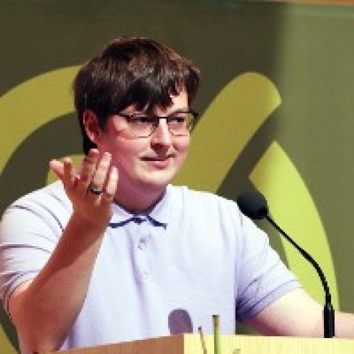 A man talks at a podium