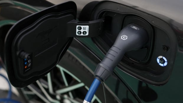 A Ford logo is seen on an electric vehicle charging cable during a press event at the Ford Halewood transmissions plant in Liverpool, Britain, December 1, 2022. 