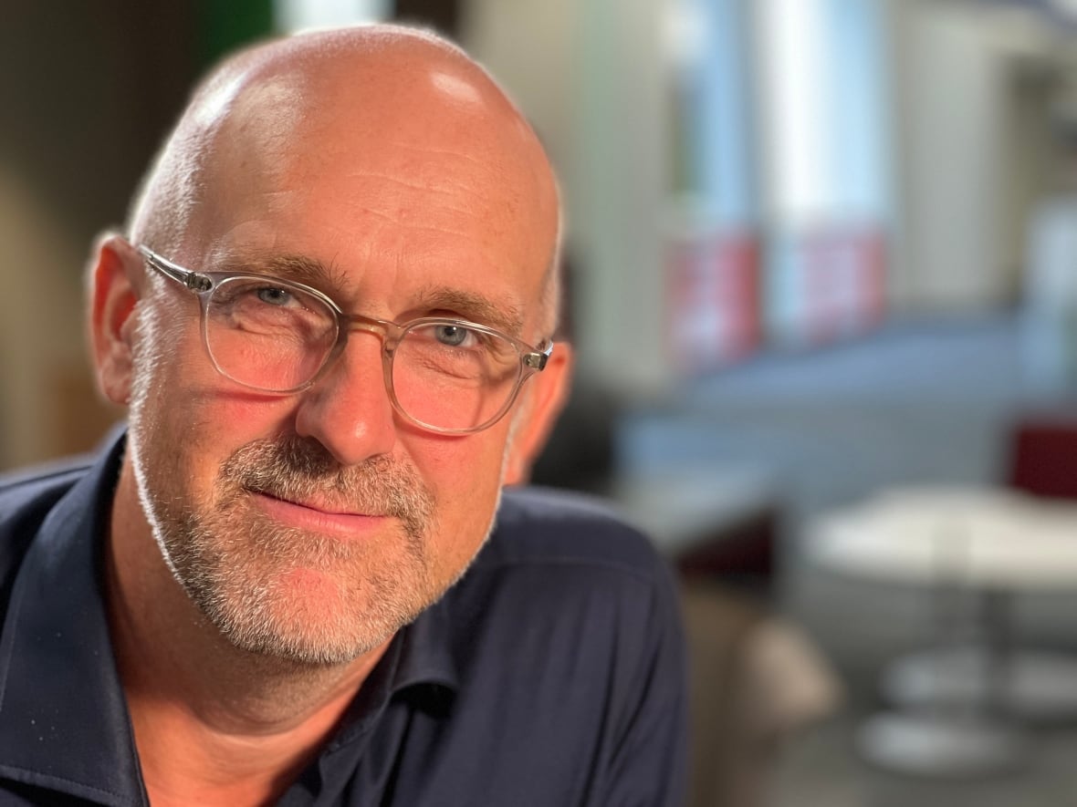 Man wearing glasses.