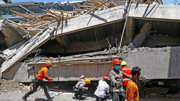 5 survivors pulled from rubble of collapsed Indonesian school, but dozens remain trapped