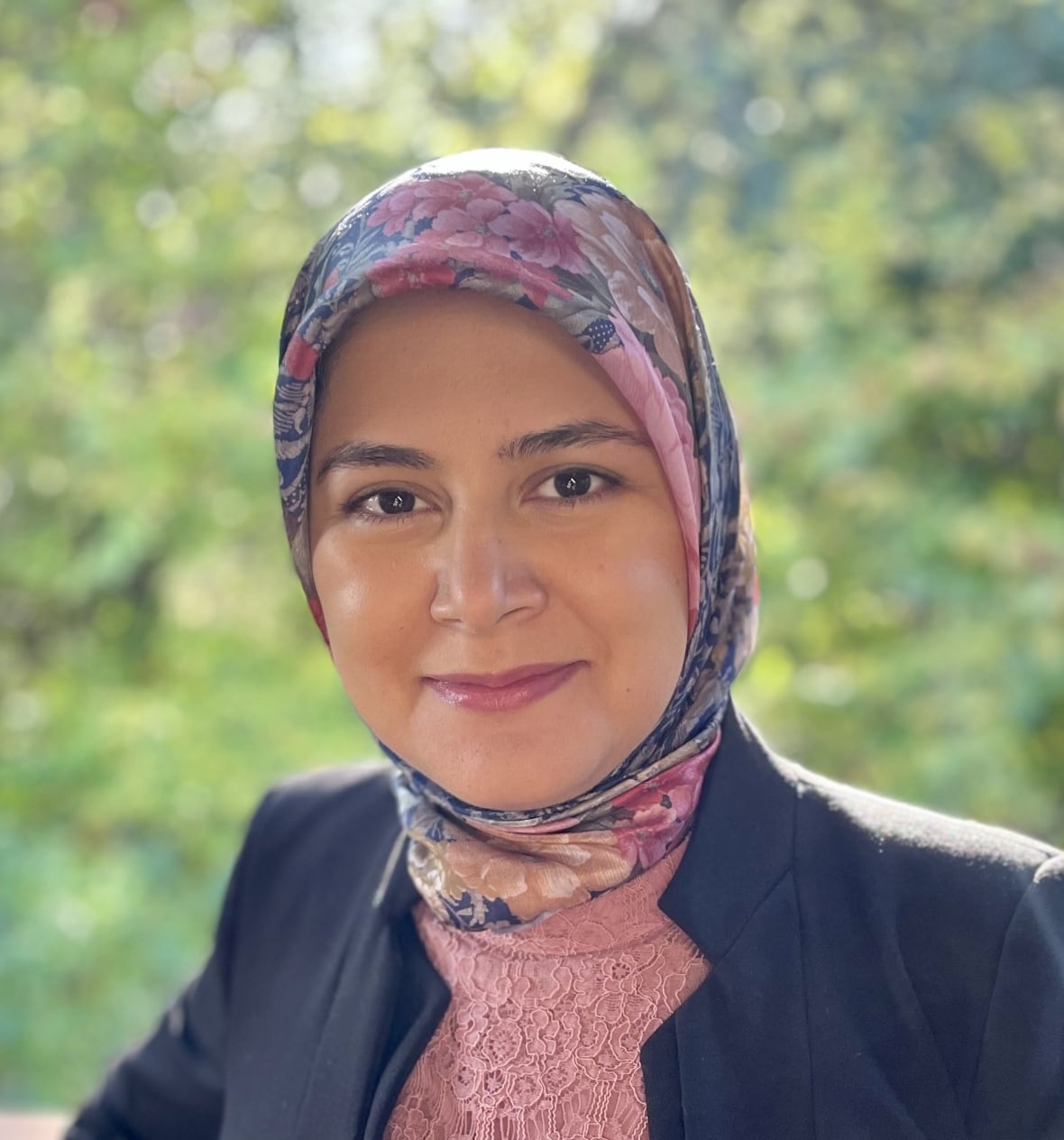 A portrait of a woman wearing a hijab.
