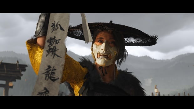 video game screenshot of a Japanese woman wearing a demon's mask.
