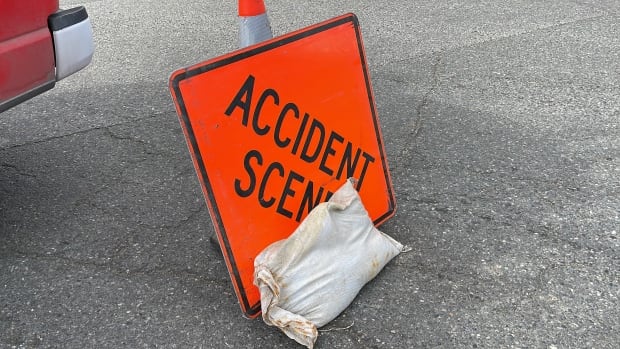An orange sign reading 'accident scene.'