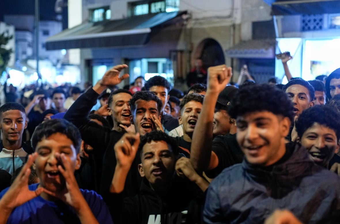 Young men are happy and crying on a busy street