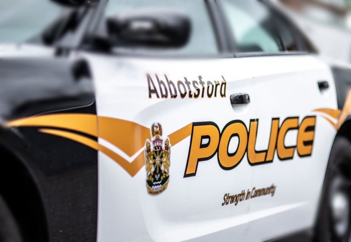 A black and white police vehicle that says Abbotsford Police on it. 