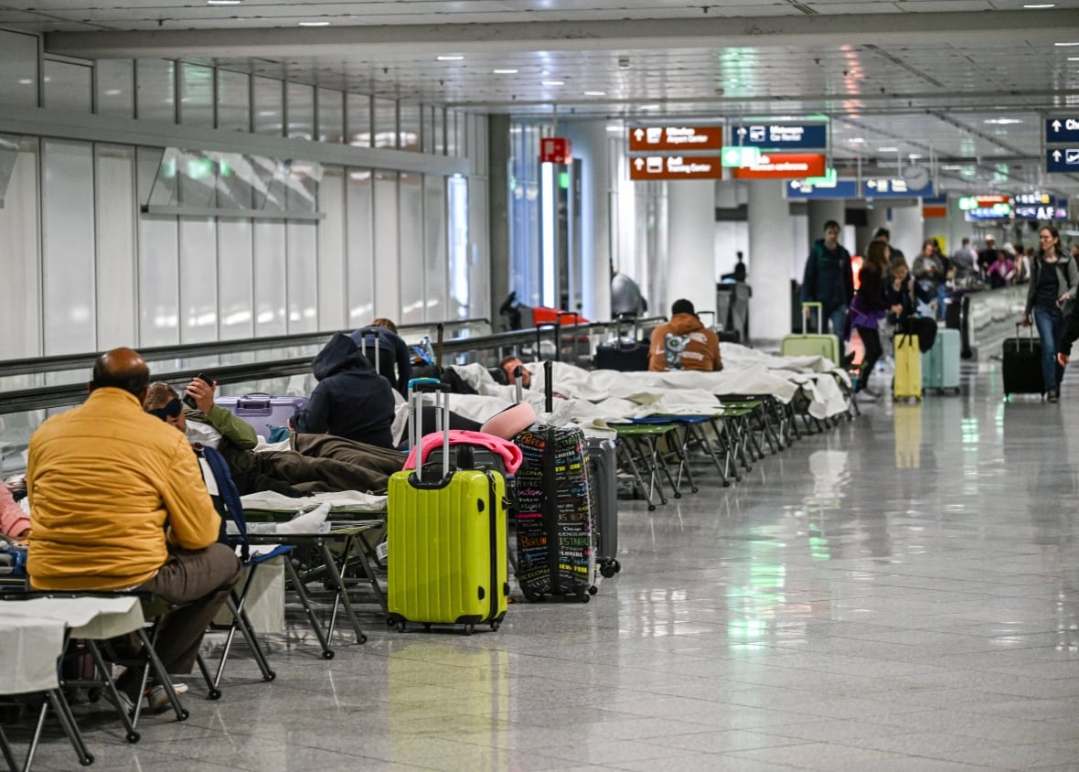 Travelers put a comfort on the children's family inside the airport.