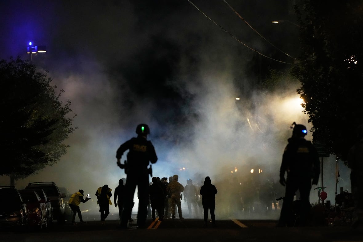 The law enforcement agents are custody after the deployment of tear gas.