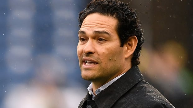 Television analyst and former NFL quarterback Mark Sanchez on the field prior to a January 8, 2023 regular-season game between the Los Angeles Rams and hometown Seattle Seahawks at Lumen Field in Washington.